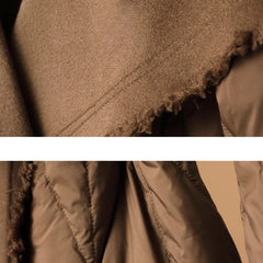Lily long belted puffer jacket for women by Christine Brewer, featuring a quilted design and waist belt in a stylish winter look.