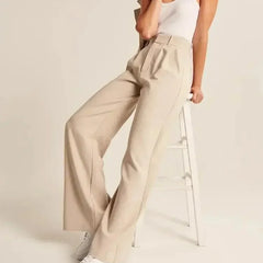 White wide-leg high-waist women's trousers by Christine Brewer, featuring a relaxed fit and high-rise design.