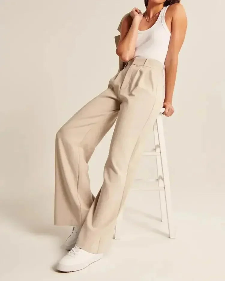 White wide-leg high-waist women's trousers by Christine Brewer, featuring a relaxed fit and high-rise design.