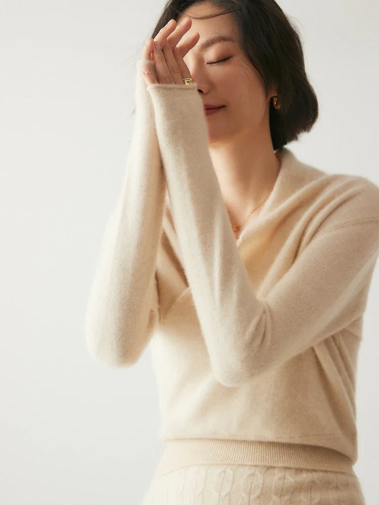 Christine Brewer Dawn cashmere sweater for women, soft beige knit with a relaxed fit and cozy collar, shown on a model.