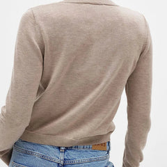 Women’s knit cardigan by Christine Brewer, featuring a cozy, stylish design in soft fabric with button closure and long sleeves.