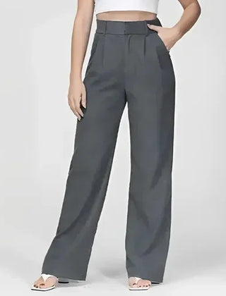 White wide-leg high-waist trousers for women by Christine Brewer, showcasing the flowy fabric and tailored fit.