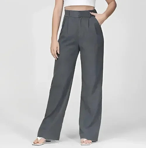 White wide-leg high-waist trousers for women by Christine Brewer, showcasing the flowy fabric and tailored fit.