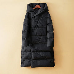 Long hooded parka for women by Christine Brewer, featuring a cozy design and a stylish, warm outer layer.