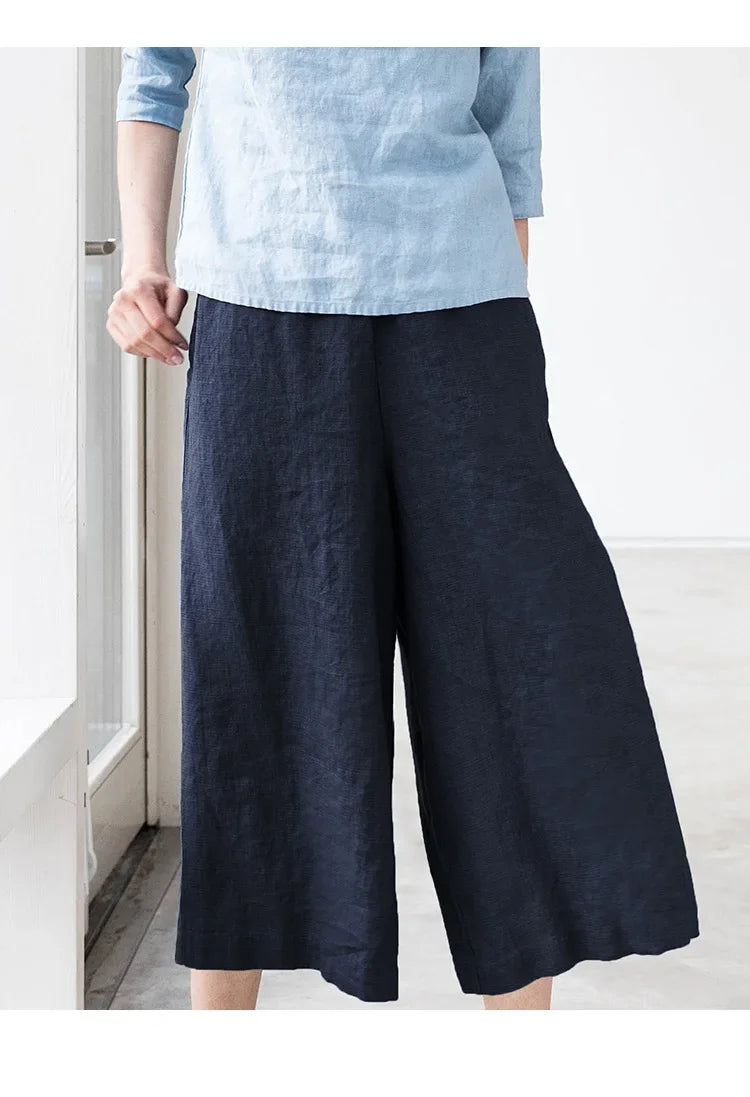 Linen cropped wide-leg drawstring trousers for women by Christine Brewer, featuring a loose fit and comfortable pull-on style.