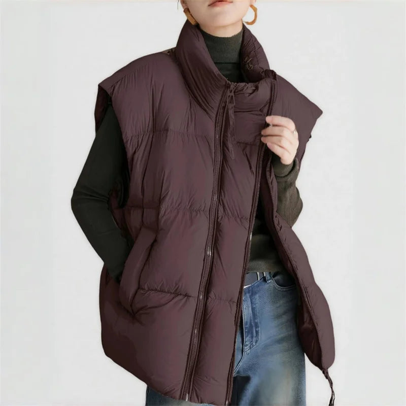 Layla cropped puffer vest for women by Christine Brewer, featuring a stylish quilted design and stand-up collar.