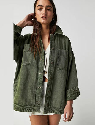 Oversized Charlotte denim shirt jacket for women by Christine Brewer, shown in classic blue denim with button closure and collar.