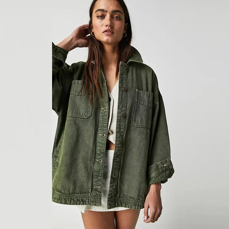 Oversized Charlotte denim shirt jacket for women by Christine Brewer, shown in classic blue denim with button closure and collar.