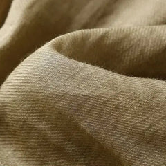 Loose tapered linen trousers for women by Christine Brewer, featuring a relaxed fit and pull-on style.