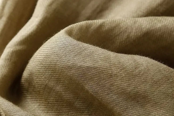 Loose tapered linen trousers for women by Christine Brewer, featuring a relaxed fit and pull-on style.