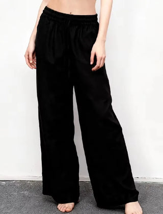 Women’s loose cotton linen wide-leg drawstring trousers by Christine Brewer, featuring a relaxed fit and comfortable pull-on style.