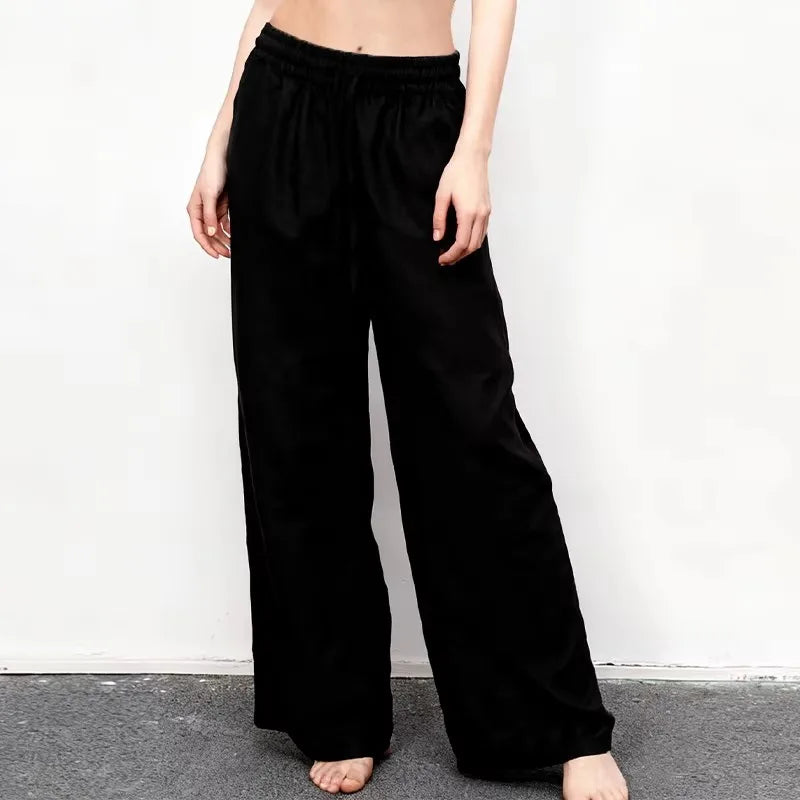 Women’s loose cotton linen wide-leg drawstring trousers by Christine Brewer, featuring a relaxed fit and comfortable pull-on style.