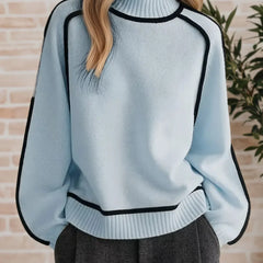 Eva loose fit roll neck sweater by Christine Brewer, showcasing a tailored chic design in soft, cozy fabric.