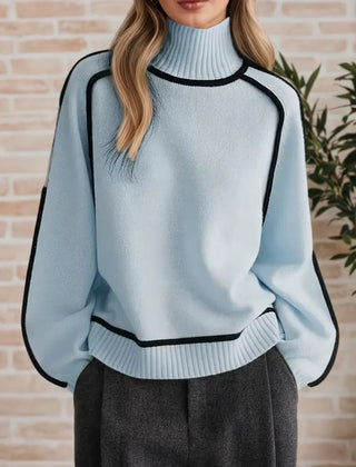 Eva loose fit roll neck sweater by Christine Brewer, showcasing a tailored chic design in soft, cozy fabric.