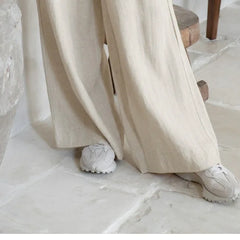 Linen wide-leg trousers for women by Christine Brewer, loose pull-on pants with a relaxed fit and casual style.