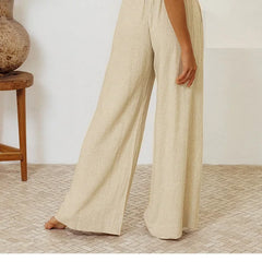 Women's linen wide-leg trousers by Christine Brewer, loose pull-on pants showcasing a relaxed fit and breathable fabric.