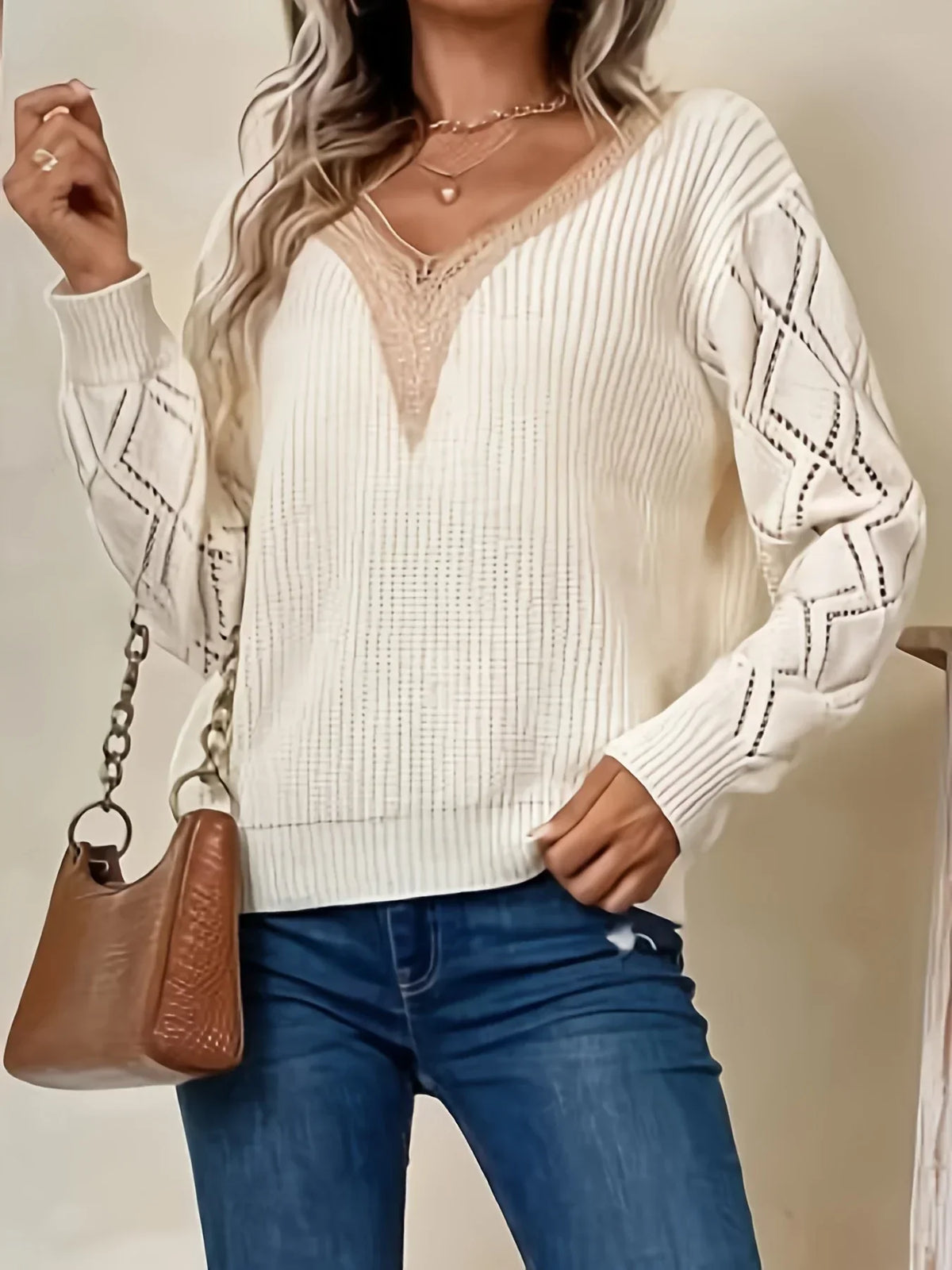 Beige v-neck sweater for women from Christine Brewer's Jenna collection, featuring a soft knit fabric and classic fit.