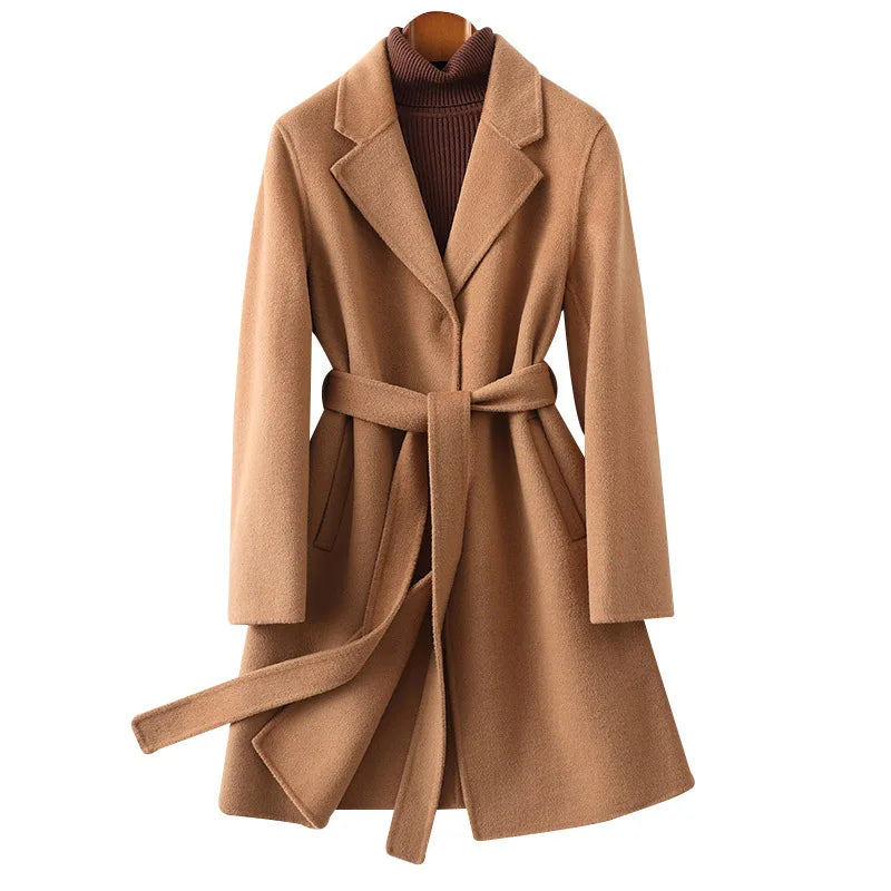 Olivia long belted wool coat for women by Christine Brewer, shown in a stylish, tailored design with a belt and classic collar.