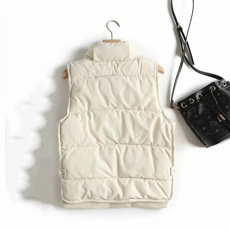 Ruby stand collar puffer vest for women by Christine Brewer, featuring a sleek design and quilted texture.