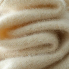 Women’s Dawn cashmere sweater by Christine Brewer, soft beige knit with long sleeves and a cozy, elegant fit.