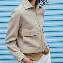 Christine Brewer Isla cropped zip-up utility jacket for women, shown in olive green with multiple front pockets and a fitted style.