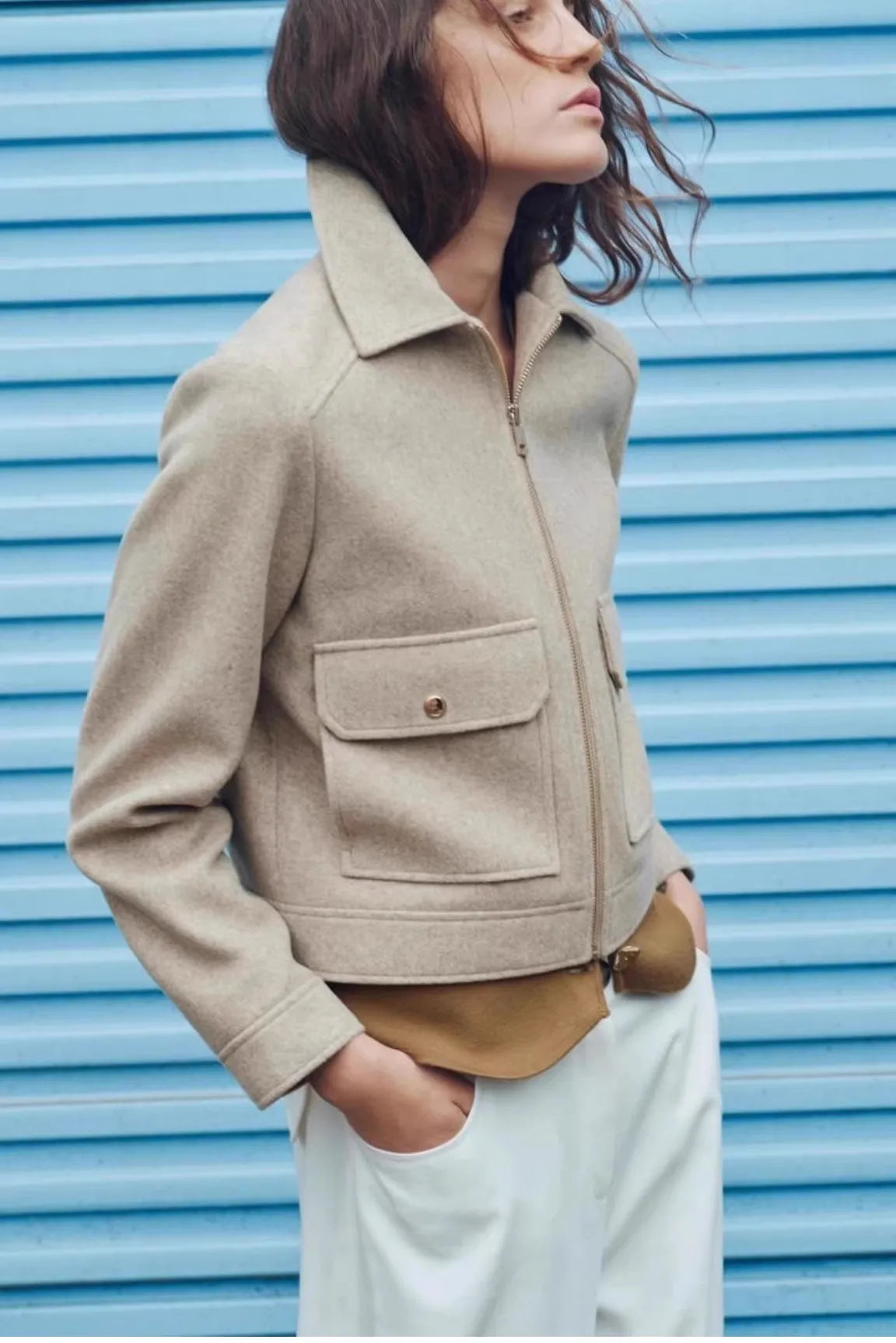 Christine Brewer Isla cropped zip-up utility jacket for women, shown in olive green with multiple front pockets and a fitted style.
