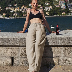 Knit wide-leg drawstring trousers for women by Christine Brewer, loose pull-on pants with a relaxed fit and comfortable design.
