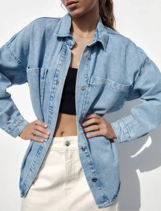 Nora relaxed denim shirt jacket for women by Christine Brewer, shown in light blue with button-up front and classic collar.