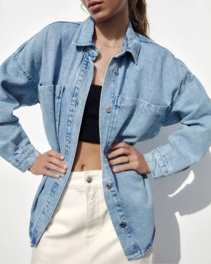 Nora relaxed denim shirt jacket for women by Christine Brewer, shown in light blue with button-up front and classic collar.