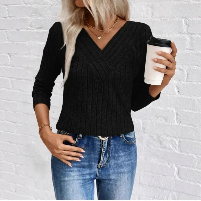 Kaitlyn striped women's sweater by Christine Brewer, featuring a cozy knit fabric with colorful horizontal stripes.