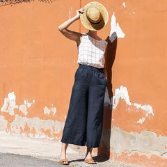 Women's linen cropped wide-leg drawstring trousers by Christine Brewer, loose pull-on pants with relaxed fit and breathable fabric.