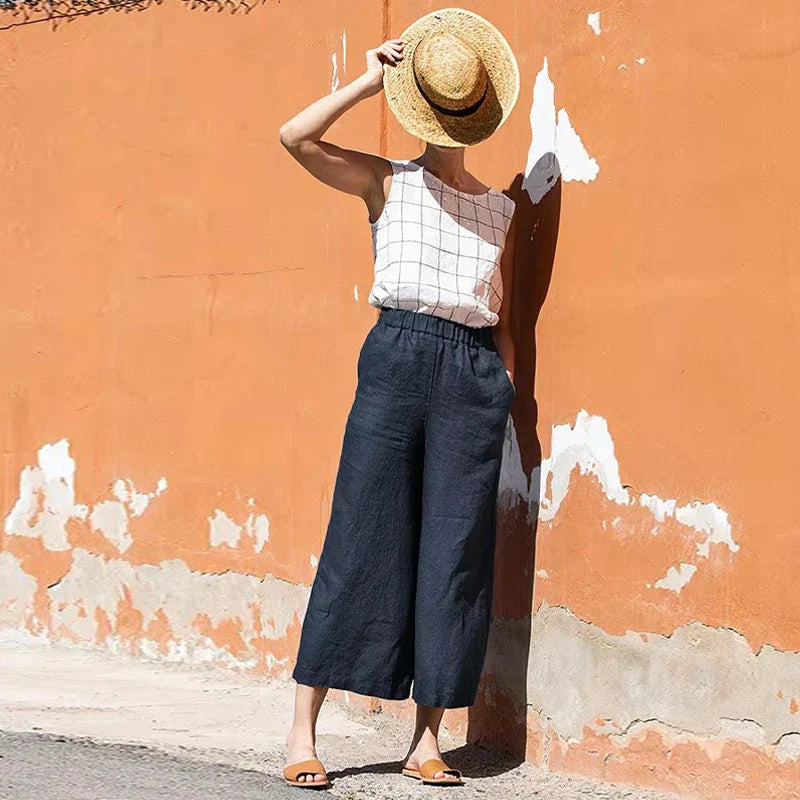 Women's linen cropped wide-leg drawstring trousers by Christine Brewer, loose pull-on pants with relaxed fit and breathable fabric.