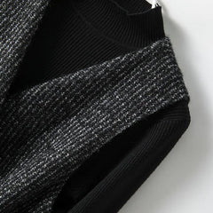 Women’s longline tweed coat with belt by Christine Brewer, featuring a stylish, textured design and classic collar.