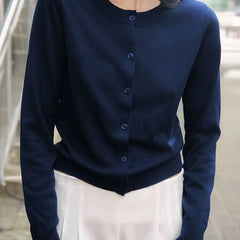 Women’s knit cardigan by Christine Brewer, featuring a cozy design with long sleeves and button-front closure.