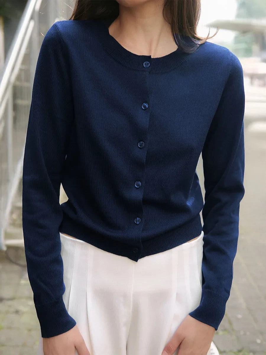 Women’s knit cardigan by Christine Brewer, featuring a cozy design with long sleeves and button-front closure.