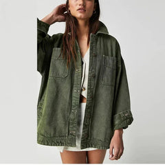 Oversized denim shirt jacket for women by Christine Brewer, featuring classic blue denim with button front and relaxed fit.