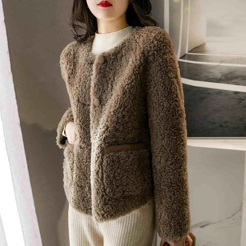 Emily glamorous faux fur coat for women by Christine Brewer, shown in a stylish, plush design perfect for cold weather.