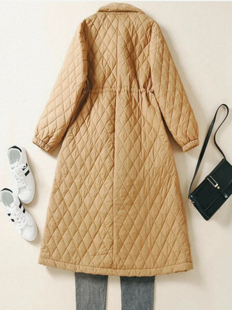 Longline pink puffer jacket for women by Christine Brewer, featuring a warm, quilted design and a high collar for winter wear.