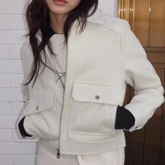 Isla cropped zip-up utility jacket for women by Christine Brewer, featuring a fitted design, multiple pockets, and a front zipper.