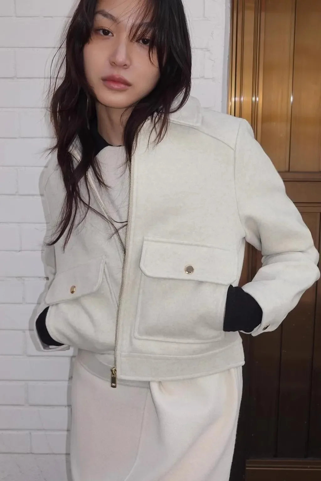 Isla cropped zip-up utility jacket for women by Christine Brewer, featuring a fitted design, multiple pockets, and a front zipper.