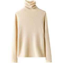 Women's cashmere turtleneck sweater by Christine Brewer, featuring a cozy, fitted design in a soft, neutral color.