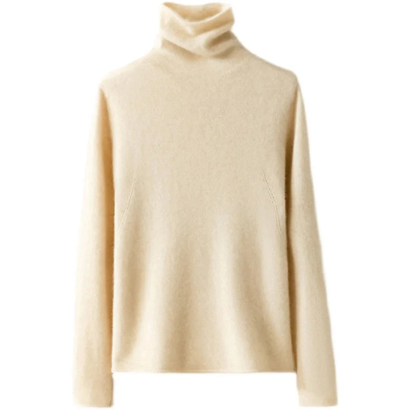 Women's cashmere turtleneck sweater by Christine Brewer, featuring a cozy, fitted design in a soft, neutral color.