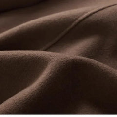 Brown double-breasted wool coat for women by Christine Brewer, featuring a stylish fit and classic design.
