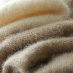 Helen cashmere sweater for women by Christine Brewer, soft beige knit with a relaxed fit and ribbed cuffs, styled on a mannequin.