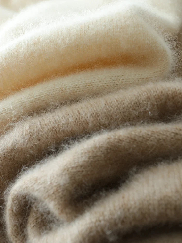 Helen cashmere sweater for women by Christine Brewer, soft beige knit with a relaxed fit and ribbed cuffs, styled on a mannequin.