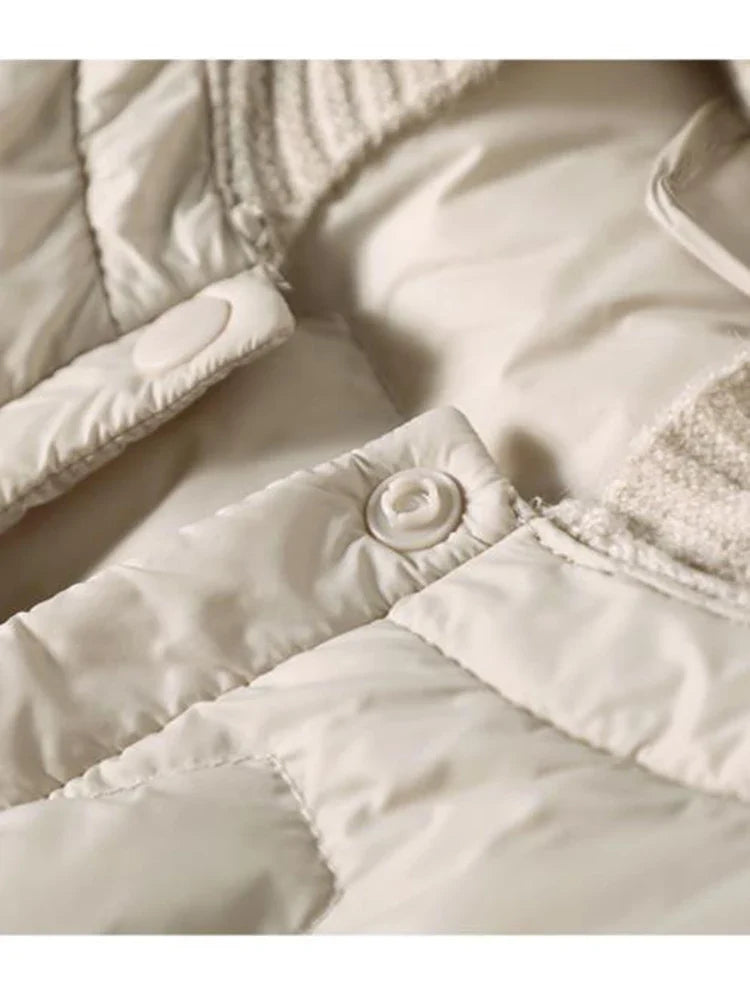 Women’s Zoe hooded quilted puffer jacket by Christine Brewer, featuring a stylish quilted design and cozy hood for cold weather.