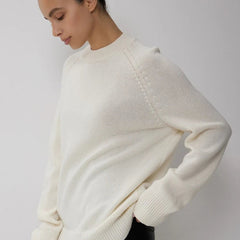 Oversized wool sweater for women by Christine Brewer, featuring a cozy fit and soft knit fabric in neutral tones.