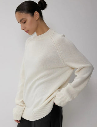 Oversized wool sweater for women by Christine Brewer, featuring a cozy fit and soft knit fabric in neutral tones.