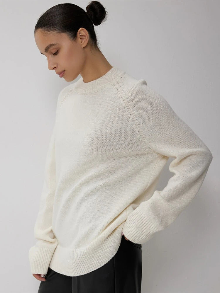 Oversized wool sweater for women by Christine Brewer, featuring a cozy fit and soft knit fabric in neutral tones.