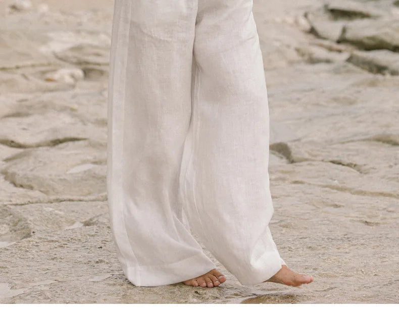Women’s linen wide-leg trousers by Christine Brewer, loose pull-on pants with a relaxed fit and wide-leg design, shown in natural fabric.